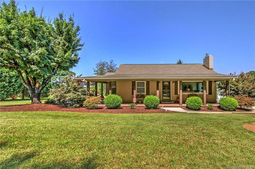 This home is gorgeous inside and out! You must see the fantastic views. It truly offers a country setting just minutes from I-77, shopping, and dining. Major renovations in recent years. 2 bedrooms and 2 bathrooms with refinished hardwoods throughout. Both garages are complete with epoxy flooring and are insulated. Granite countertops throughout. Custom kitchen with Bosch down draft LP gas cooktop and double ovens. Lushly landscaped with waterfall pond and perennial gardens.