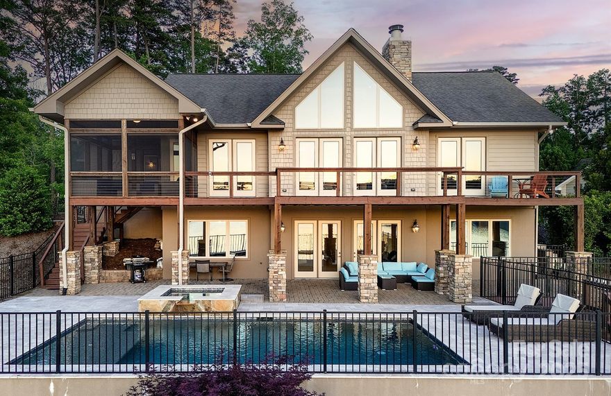 Multi-Million Dollar View! This stunning rustic modern home on Lake Tillery offers panoramic views of the lake, Uwharrie National Forest, and Morrow Mountain State Park. Enjoy open-concept living with exposed beams, a vaulted tongue and groove wood ceiling, and a striking rock fireplace. Floor-to-ceiling glass walls and doors open to a large deck overlooking a sparkling pool and spa. The home features a beautiful kitchen, main floor primary suite, open den, wet bar, 3 bedrooms, 3 full baths, and a half bath. Perfect for relaxing or entertaining, this property also includes a 2-slip boathouse, making it easy to enjoy all that lake life has to offer. Whether soaking in the spa, lounging by the pool, or taking in the incredible views, this lakefront retreat delivers unmatched luxury and charm in every detail. Experience the best of Lake Tillery living in a home designed to impress and built to embrace nature’s beauty.