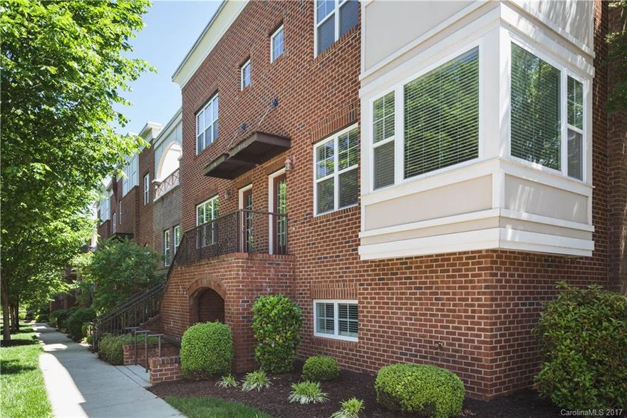 You will love this well-maintained Brownstone! Walk/Bike to shopping, dining & Davidson's hip downtown! Chef's kitchen w/granite, tumbled-tile backsplash, S/S appliances, including gas cooking & kitchen island.  Hardwds throughout main floor.  Master B/R w/a generous Master Bath, custom vanity, garden tub & separate shower.  Bottom floor w/a separate entrance & that space can be used as an office/3rd bedroom- it has a full bath!  Live/Work/Play! Enjoy the lake views from your rooftop terrace!