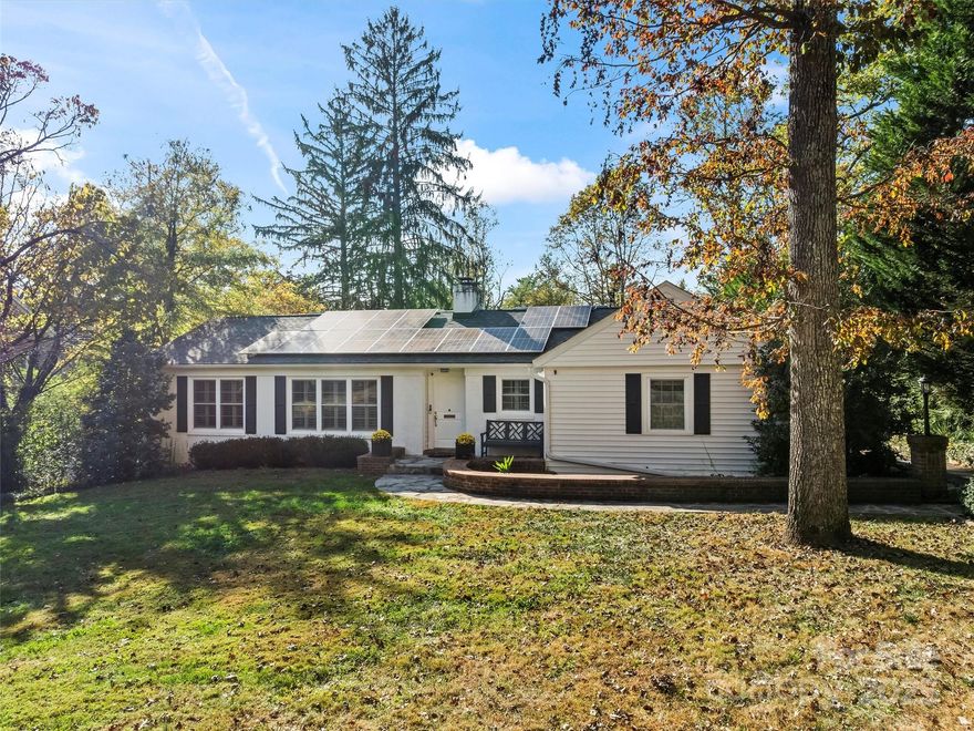 Built in 1963, this home offers a classic layout with room to grow. Set on a spacious 0.6-acre lot in prestigious Biltmore Forest—one of Asheville’s most desirable and well-established neighborhoods—it features a timeless main-level design with a living room, dining room, kitchen, office, 3 bedrooms, and 2 full baths. Enjoy the large screened-in rear porch overlooking the private backyard, perfect for gardening, relaxing, or entertaining. Multiple garden areas enhance the outdoor space, and a hot tub on the back deck provides an ideal spot to unwind.

The lower level includes a cozy family room, a workshop, and an additional 922 sq ft of finished flex space not included in the total square footage. This versatile area offers possibilities for a workout room, office, playroom, studio, or guest accommodations. New insulation and solar panels provide ample energy efficiency, resulting in minimal to no consumption.

Conveniently located close to Carolina Day School, Biltmore Forest Country Club (membership required), and multiple neighborhood parks, this home offers both accessibility and lifestyle amenities within a highly regarded community.

The property also provides substantial potential for future growth, including the option to expand the home to a second level for additional living space. Don’t miss this excellent opportunity to own a home in sought-after Biltmore Forest.