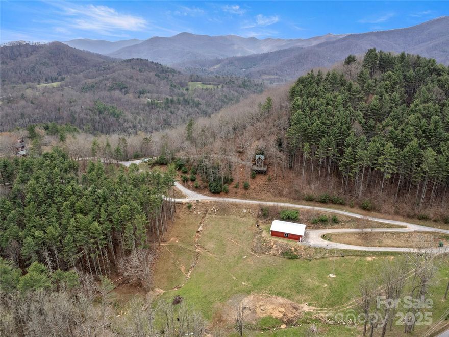 Drive the picturesque road along the Pigeon River to get to your 14.7+ acre mountain homestead. 360
degree views from the top of this property would give endless views and possibilities. Whether you
are looking for your own private estate or a multiple family compound, this property has much wooded
wildlife and natural rock formations to appeal to the nature lover. Come take a look, this one won't
last long!