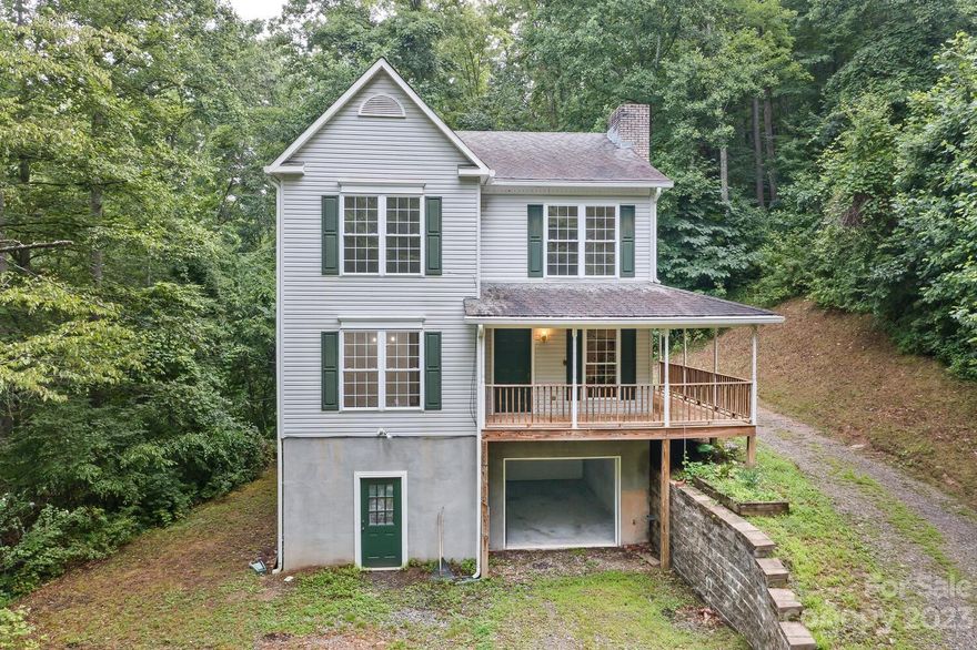 Nestled between Reems Creek and the Blue Ridge Parkway this 2-story home with basement features just over 12 acres of land, 4 bedrooms and 3 full bathrooms, 1 car garage. Less than twenty minutes from downtown Asheville, either by Reems Creek to Merrimon Avenue, or via the Blue Ridge Parkway.
This tranquil area, under a canopy of trees, provides a private sanctuary with views of the natural landscape, and the wildlife of the forest, often drawn in by the included flowing spring. Less than a 3-mile journey on Ox Creek to the parkway access at Bull Gap with other hiking and trails along the way, this space has a generous playground of its own, with an abundance of nature to satisfy the outdoor enthusiast right in your own backyard. Even in all this serenity, Spectrum Hi-Speed Broadband Internet and other services are available for this location.
Come see this beautiful place for yourself! 
See MLS#:4091847 +/- 10 Acres and potential water rights will be sold to the neighbor.