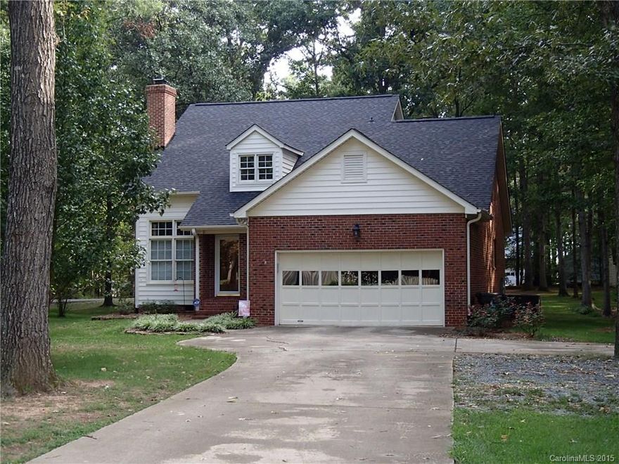 Immaculate full brick 1.5 story home on 1.3 acre lot w/ NO HOA! Beautiful, 3/4" real hardwood floors on main floor (tile in kitchen/baths); owners' suite on main. 2-story great room with masonry fireplace (currently has gas logs, but can be wood burning.) Owners bath has granite & custom tile work, dual vanity, sep.  shower & garden tub. 3 generous size bedrooms up. Upgrades done in 2013: new arch. roof, kitchen remodel, tile floors. All baths have granite countertops & tiled flooring. MUST SEE.