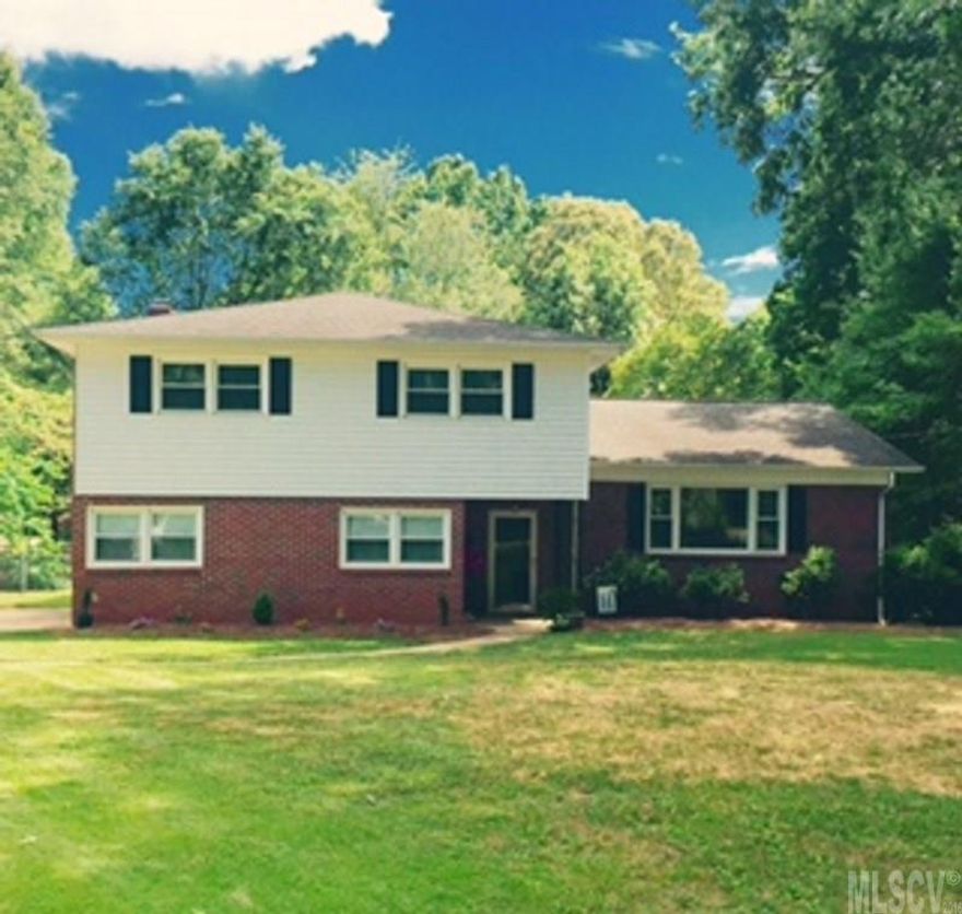 Modern renovations. Come inside & be pleasantly surprised by the size & renovations done w/this 4 BR/2.5 BA home. As you enter you will see the open floor plan w/ refinished hardwood floors accented by the vaulted ceilings. The kitchen is all brand new cabinets, granite counters, stainless appliances that are still under warranty. The home offers 2 large living areas & a formal Dining Room. Downstairs Great Room is huge with brick fireplace, renovated 1/2 bath, & glass doors leading to the patio overlooking a fenced-in level backyard on almost 1/2 acre. Replacement windows, roof 2007, heat pump 2005, replaced water heater, electrical & plumbing updates, many fixtures updated, & trees removed. Refrig, washer, dryer remain. Established desirable neighborhood with community pool available, city parks, close to I-40. This home even has a basement.