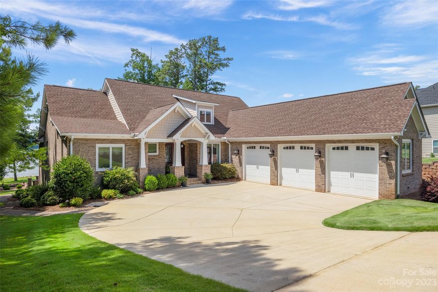 Custom craftsmanship at it's finest, this full-brick waterfront beauty will take your breath away! Pulling into the courtyard 3-car garage, you are greeted by a mahogany dbl front door, soaring 12' ceilings, Brazilian wood floors, & lake views. The kitchen boasts Jenn-Air appliances, gas cooktop, & fireplace in the keeping room. The primary suite has marble dual vanities, travertine shower, & opens to the lanai. Expansive windows take full advantage of the water views & ideal west facing rear for sunsets! The lanai leads to a fire pit area, & paver walk to the covered floating dock. See attached for extensive list showing the quality that went into this home! Edgewater is a resort style community w/ amenities incl golf, pool, clubhouse, & more. 2nd floor BR is counted as a BR but varies from MLS definition as there is no closet. 3,098SF of which 522SF is an unpermitted addition that otherwise meets the definition of living area. PRICED BELOW APPRAISED VALUE. https://vimeo.com/845684337