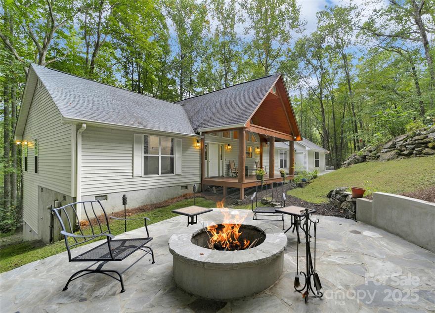 Pristine Privacy at its finest! Three bedrooms and two full baths with a huge great room and well-appointed kitchen. All secluded and surrounded by mature hardwoods at the end of the street, behind the gates of prestigious Sapphire Valley. Floors throughout are beautiful true hardwood and tile. Kitchen has very unique brick flooring with a very stylish matching brick backsplash as well. Two separate sinks, one in the large functional island. Large great room with gas log fireplace, lots of room for entertaining family and friends. The covered front porch / deck looks out at the finely manicured, landscaped yard. Off to the side is a very inviting fire-pit area, for gatherings outside on the starlit evenings. The rear deck / porch looks out over the native flowering bushes, berry bushes and ferns. There's a small spring running in the back. Circular driveway brings you from the dead end of the paved street to the two-car garage. Plenty of extra parking for friends as well. All of the amenities of the Sapphire Valley Association are part of it. You will want to hurry to see this!