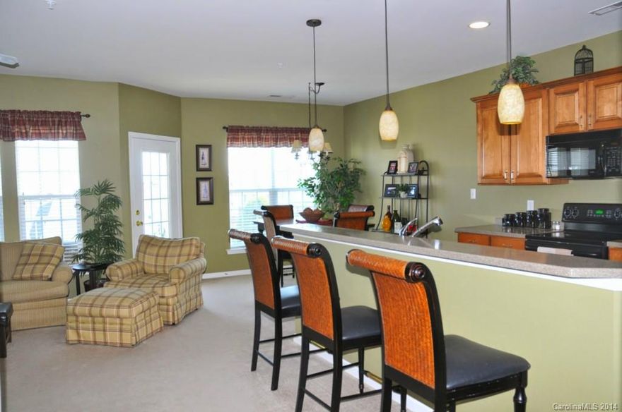 Condo is in an excellent location in the desirable heart of Ballantyne.  It is within walking distance to the YMCA, shopping, restaurants, entertainment, and so much more. This top floor gated community condo has tile floors in the kitchen and bath, upgraded cabinets, a great open floor plan, and the serene benefit of being on the 4th floor!  The balcony has a beautiful view of the city! This condo could also be a great investment opportunity. Condos have rented from 1,100-1300 per month.