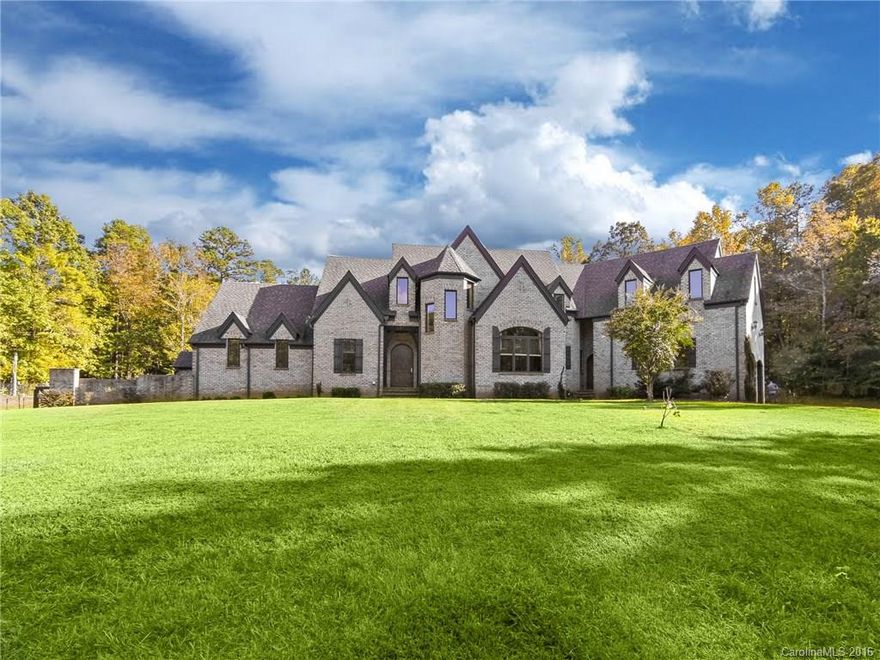 Fabulous all brick European estate home in Waxhaw, NC on incredible 5.4 acres, 30 minutes from uptown Charlotte! 4 BR, 4.5 BA, custom design throughout. Main level includes 2-story great room w/gas FP, dining room w/cathedral ceiling. Gourmet kitchen overlooks yard & lazy river pool. Master suite on Main w/gas FP, 2 BRs & Guest Suite are located on 2nd level. Laundry on Main & 2nd floor. Billiards Room, Home Theater & great storage on lower level w/in-law suite & separate private access.
