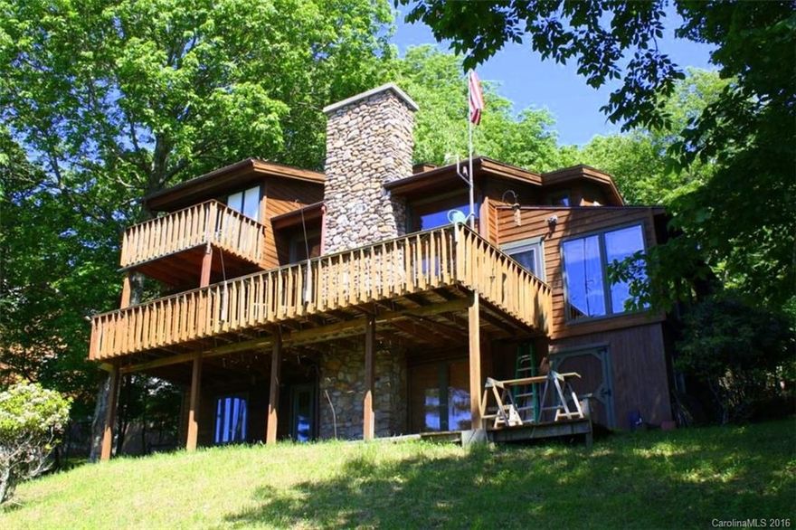 Extreme 40 mi Views, Custom Cabin w/ Flat Driveway & Tons of Parking, backed by Protected Watershed Land, V. Private Location, Walk to Ski Slopes, Much Glass facing Multi Mt Views, 2 Wood Burning F Places, All Wood Fl on Main & Upper, Nice, Glassed Sun Rm, Lrge Dining Area, Full BA on Main, 3 BR Suites each w/ Private BAs & Deck on Upper, 2 BRs & 1 BA on Lower w/ Family Rm & Second F Place, 6 Separate Decks, apprx 1,100 SF, Workshop off Lower Deck, must see