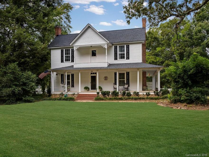 Historic farmhouse nestled among 7+ acres.  Arched entry ways, hardwood flooring and newly painted balusters are a few of the features that add so much character to this home.  Beautiful wrap around porch provides the perfect setting to enjoy the outdoors. Master bedroom on the main level. Interior recently painted. Updated electrical wiring.  Remodeled half bath downstairs. New granite counter tops and stainless appliances in kitchen. Newer roof and Hybrid HVAC.  Fireplaces/chimneys sold as is.