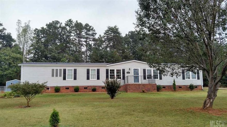 Updated manufactured home is move in ready with fresh paint, carpets, flooring, large back deck and beautiful open floor plan in the main living area.  Enjoy a large living room with new electric fire place.  Expansive master bedroom, bathroom and walk in closet.  A total of 4 bedrooms and 2 bathrooms, provide room for a crowd! Roof, hot water heater, heating and cooling all replaced within the last 3 years.  New double hung, easy maintenance windows in every room, including new patio doors.  Don’t miss the included storage building, attached garage area and spacious laundry room. This home is located in a quiet neighborhood, convenient to all amenities and minutes to highway 321 for easy access to Lenoir, Hickory and Charlotte.   Book your tour today, this home won’t last long!