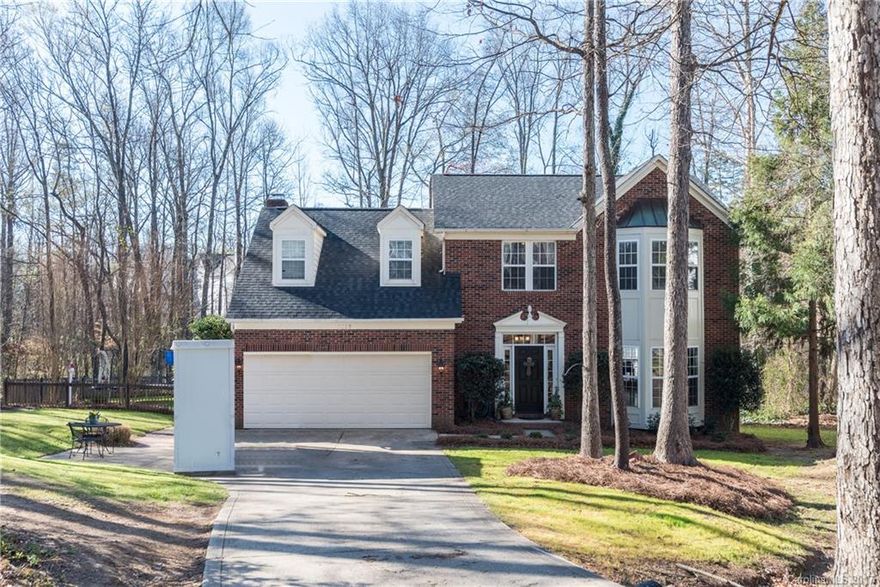 The features you demand in the location you desire.  Discover serene, wooded living in the heart of Highland Creek.  Beautiful, open plan home has been updated to create an inviting living environment.  Kitchen has been updated with custom cabinets, pantry, granite island and bookcase.  Entertaining is a delight:  enjoy tea from the screened porch or cool drinks poolside.  For the gardener, there is room for the garden you have been wanting.  Wander with wonder through screened woody lot.