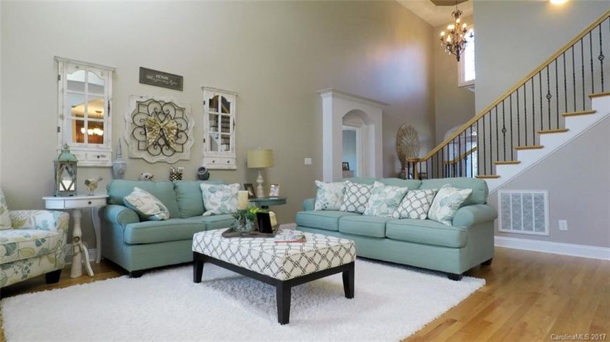 Immaculate full brick home in Channing park with gleaming hardwood floors, 2 story great room, huge kitchen with island and breakfast area. Spacious master on main and guest suite. Upstairs has two additional large bedrooms and bonus room. Deck and screen porch for entertaining. This home shows like a model home and is in excellent condition. Won't last long so hurry and check it out!