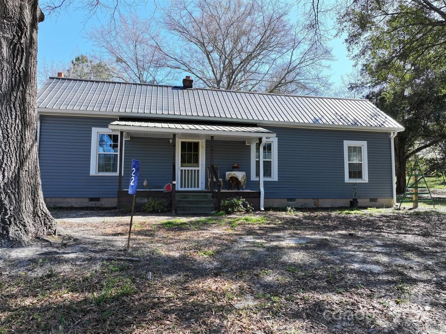 Uncover rustic charm at 22 Treasure Rd, a 2-bedroom, 1-bath gem nestled on a 6.64-acre bounty in Wadesboro. 6-room  home with 1225 sq ft of sunlit space, natural beauty meets modern comfort. Rely on the modern conveniences of a newly installed mini-split for heating and air needs, a durable metal roof offering lasting protection, and striking new vinyl siding enhancing the timeless appeal. With many updates running out of hot water should not be an issue as the new tank-less water heater stands ready to go. This property's individualities extend beyond its frame as its expansive lot size promises ample opportunities for homesteading, gardening, or simple peaceful retreats. Envision a life untouched by city chaos, forged by the rhythm of nature and tranquility in a house transformed into home. Step towards that vision by scheduling your showing of this property; a rewarding blend of comfort and rusticity.