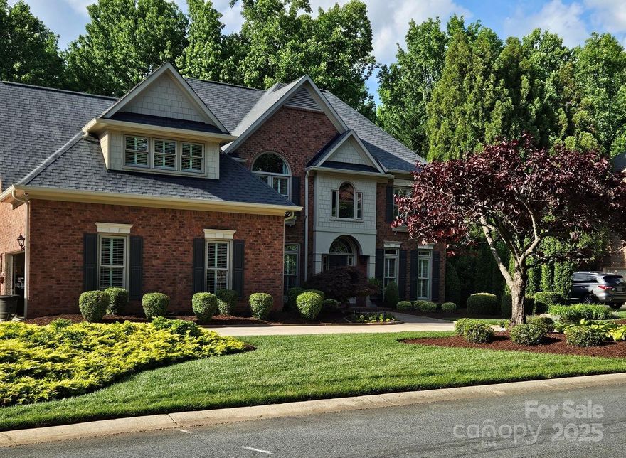 Gorgeous John Wieland home with a full, finished basement and a circular drive.  Large lot with a private back yard. 
 Outdoor living at its finest with a huge paver patio and a firepit area.  Stone fireplaces in the 2 story great room, kitchen completely remodeled with new cabinets, counters, and appliances.  Third car garage was converted into a heated and cooled mud room with heated floors.  Screened porch.  Storage area with a garage door located in the basement area.  Second fireplace in the basement.  All windows have been replaced.  No stone left unturned.