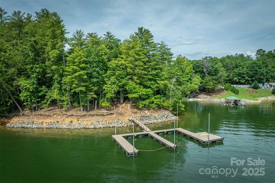 This remarkable 1.8-acre property is one of just three exclusive lots that comprise an expansive peninsula stretching into the main channel just beyond Bear Creek Marina. Enjoy a gently sloping building site that offers easy access and a comfortable walk down to your private, oversized floating dock—already in place and ready for your waterfront adventures. This is a rare chance to claim a unique and scenic piece of Lake James. Don’t miss the opportunity to experience this exceptional setting for yourself.