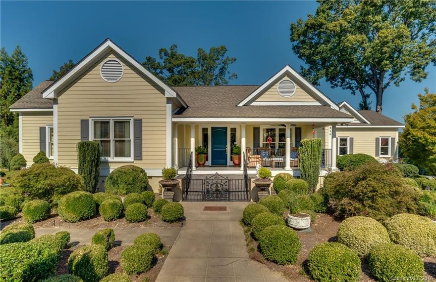 This 1920 farmhouse had been modernized in grand style. 3 BR with en-suite baths, 2 car garage and designer features throughout. Amazing landscape and water features offset the beautiful property. All 9'8" ceilings with heavy molding, refinished hardwood floors, gas logs and floor to ceiling windows. Master suite bath has Travatine Tile, his-her sinks, marble counters and large walk-in closet leading to laundry room. Gourmet kitchen leads to large adjoining den with access to patio and garden.