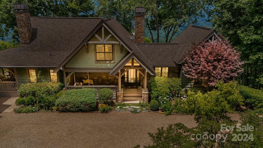 When you enter this meticulously maintained home, you will be greeted with some of the most spectacular views in Western NC. Featuring vaulted wood ceilings, multiple gorgeous stone fireplaces, beautiful heart pine floors and large windows throughout, it feels like a true mountain retreat. The open floor plan flows out onto incredible covered porches and decks making this home perfect for entertaining. With four generously sized suites and a bunk room, there is room for all of your friends and family to enjoy this paradise. The impeccable landscaping welcomes you to a flat driveway, an oversized auto court, and a 2 car garage, all of which can be challenging to find in the mountains. The ultimate highlight is the main covered porch, which features a wood burning fireplace, soothing sounds of a waterfall and epic sunsets.While taking in the cool summer air above 3,600 feet, you will never want to leave. Balsam Mountain Preserve is a private club community with fully completed amenities.