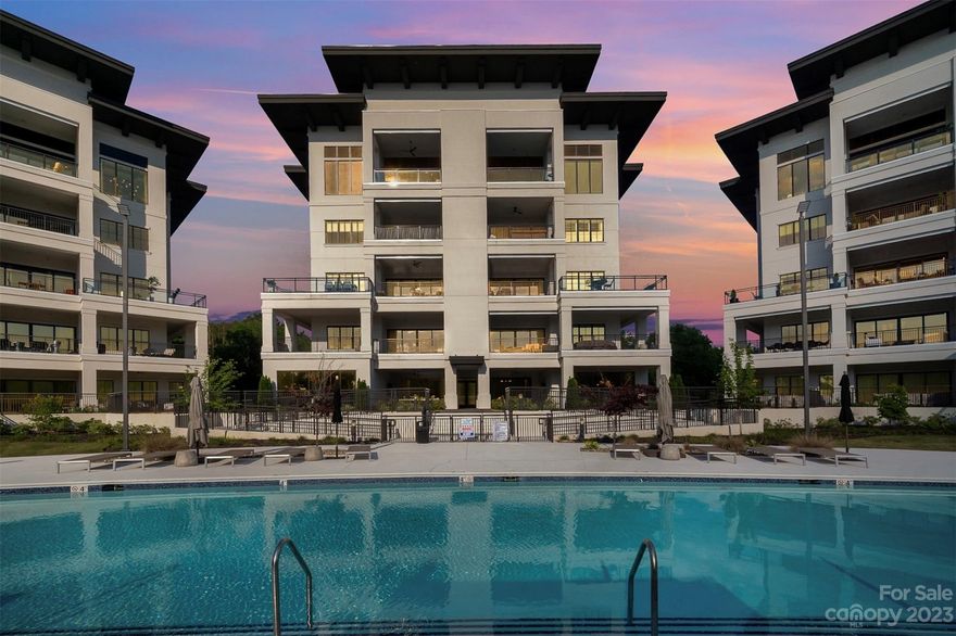 Discover a new standard of luxury living at the uniquely designed residences of Watermark! A rare opportunity to own in this prestigious gated community offering state-of-the-art fitness center, exquisite pool/hot tub/cabanas & sophisticated club house, situated among the finest restaurants, marinas, and Lake Norman. This coveted Building 300 unit has secure private elevator access, inside you will find luxurious living with upscale finishes, wide plank wood floors & a spacious wrap around lanai overlooking the resort-style pool. The epicurean dream kitchen is well appointed with Sub-Zero fridge + wine fridge + 2 dishwashers + 48” Wolf gas range centered around an expansive 10ft quartz island; an open floorplan designed for entertaining. Primary suite offers shutters, covered balcony, dual vanities, freestanding tub, frameless shower enclosure & custom closet. Secondary bedrooms offer private ensuites with high-end finishes.