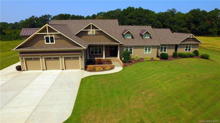 Gorgeous country estate atop 25.5 gently sloping acres was built to spare no comfort or convenience. Meticulously-kept home featuring hardwoods, tray and coffered ceilings, plantation shutters and exquisite moldings; great room with feature-wall of custom cabinetry and gas log fireplace; large chef's kitchen with breakfast bar and huge island; private owner's suite with huge walk-in closet. Too many amenities to list, you must see this exquisite estate. Great equestrian property potential.