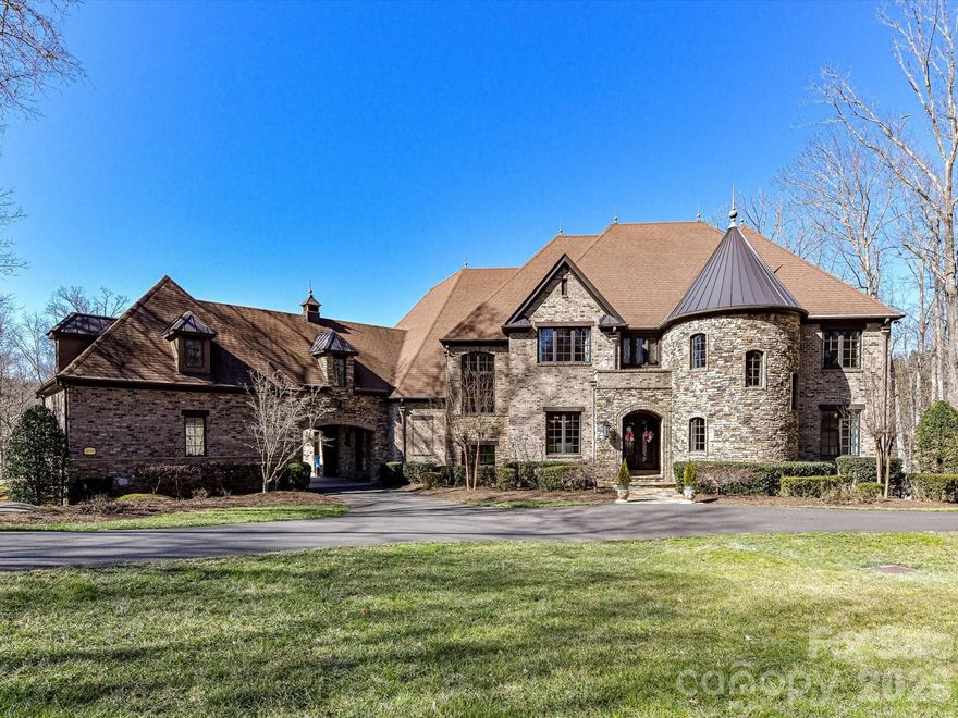 Welcome home to an extraordinary resort-style retreat where luxury, privacy, and thoughtful design come together in perfect harmony. Nestled on 7.25 beautifully wooded acres within the highly sought-after gated community of "The Enclave", this remarkable estate offers an unparalleled lifestyle in a serene and secure setting. From the moment you arrive, you’ll appreciate the sense of exclusivity and tranquility that surrounds the property. Step inside to discover a stunning open-concept floor plan designed for both everyday living and grand-scale entertaining. The heart of the home is the impressive custom-built gourmet kitchen, a true showpiece that will delight any culinary enthusiast. Featuring two oversized islands—one complete with a chef’s butcher block—this space provides abundant prep room, seating, and gathering areas. High-end finishes, custom cabinetry, and premium appliances create a kitchen that is as functional as it is beautiful. The main-level primary suite serves as a private sanctuary, thoughtfully positioned for comfort and convenience. This luxurious retreat features a spa-inspired bath with a dramatic walk-through rain shower, elegant finishes, and a serene ambiance designed to help you unwind at the end of the day. Step outside and prepare to be captivated by breathtaking views of your private wooded estate. The backyard has been transformed into a true oasis, offering resort-style amenities that rival the finest vacation destinations. Relax in the heated saltwater infinity pool, soak in the hot tub, or gather with friends around the wood-burning fireplace. The soothing sound of cascading waterfalls enhances the peaceful atmosphere, making this outdoor living space ideal for both entertaining and quiet evenings under the stars. Upstairs, you’ll find five generously sized guest bedrooms, providing ample space for family and visitors. A dedicated office offers a quiet workspace, while the home gym allows you to maintain an active lifestyle without ever leaving the comfort of your home. The walk-out basement is an entertainer’s dream. Designed with versatility in mind, this level features a cozy great room, a spacious entertainment and game area, a private home theatre, an additional guest bedroom, a full bath, and a playroom—creating the perfect environment for hosting gatherings, movie nights, and celebrations of all sizes. Ideally located in a top-rated school district, this exceptional property is just minutes from Concord Regional Airport and offers convenient access to major highways, shopping, dining, and entertainment. Despite its proximity to everything you need, the estate maintains a peaceful, tucked-away feel that is truly rare. This is more than a home—it is a lifestyle. A rare opportunity to own a private estate in "The Enclave" where luxury living meets everyday comfort. This is truly a must-see property.