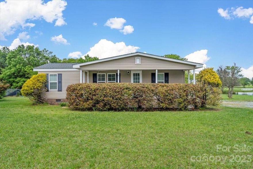 MOVE IN READY! Nicely updated home. Enjoy evenings on the deck overlooking a beautiful view of the neighbors gorgeous pond! Or enjoy quiet time on the front porch swing! Country living at it's finest within minutes of the mainstream! Located on a 1.17 acre lot.