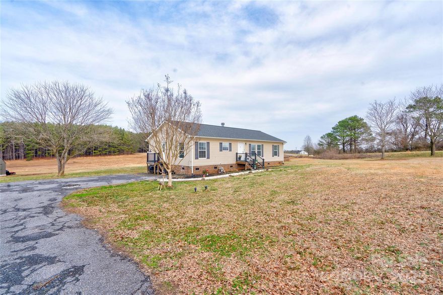 Welcome to this charming 3-bedroom, 2-bath home sitting on a sprawling 6-acre lot, offering the perfect blend of spacious and rural living. Step inside to find a warm and inviting interior with a spacious living area, a well-appointed kitchen, and a cozy dining space ideal for gatherings. Enjoy a pleasant primary suite with a sizable bath, accompanied with his and her vanities. Whether you're looking for a homestead, a mini-farm, or simply a quiet escape, this property provides endless possibilities. Conveniently located just a short drive from Shelby and Gaffney, you’ll have easy access to shopping, dining, and I-85 while still enjoying the serenity of country life. Don't miss this rare opportunity to own your own piece of paradise!