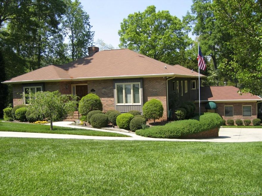 Beautiful 4 BR home located at the end of cul-de-sac street w/magnificent .64 acre park-like setting. Great view of lake from all rms on back of home & lrg deck. Updated kitchen w/granite counter tops, SS appliances & tile flooring. Master bath & hall bath updated w/seamless glass enclosures, tile surrounds & tile flooring. Plantation shutters throughout. 792 sqft office added on lower level.