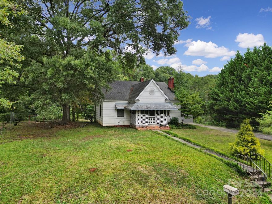 You will find this investor special in a prime location in the heart of Fort Mill. It is just minutes to I-77, Walter Y Elisha Park, home of the annual Strawberry Festival, Kingsley Town Center, the lovely downtown Fort Mill. The home has a great layout; coming from the screened-in front porch you'll walk into the living room, and down the hallway to the left are the 2 bedrooms, at the end is the full bathroom, and to the right is the kitchen with the laundry room off the back of the house. It's on over .5 acre, with a spacious backyard that is fully fenced and equipped with a storage shed. The driveway is shared. With some renovation, this home could make an excellent flip or long term rental; come realize its potential!