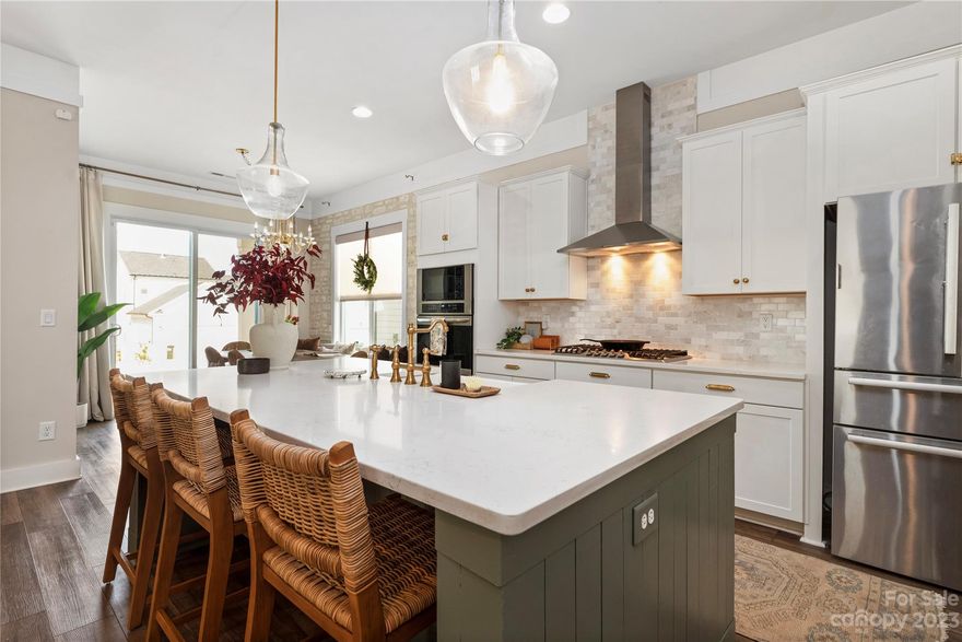 Welcome to this extraordinary 5BR, 3.5BA home situated in the esteemed Tennyson community. As you enter, you'll immediately notice the impeccable design and the seamless flow between the living room, breakfast nook, and well-equipped kitchen. The kitchen is adorned with a quartz island, stainless steel appliances, and elegant shaker-style cabinetry. The living room is bathed in natural light from the large windows and offers automated Lutron blinds for added privacy. For formal gatherings, the separate dining room is the perfect setting. Step outside and find a charming porch swing, creating a serene spot for relaxation. Upstairs, the bedrooms feature designer light fixtures and ample closet space. The meticulous attention to detail throughout the home further enhances its refined appeal. The Tennyson community offers amenities such as a dog park and walking trails, providing a perfect balance of suburban tranquility and urban convenience.