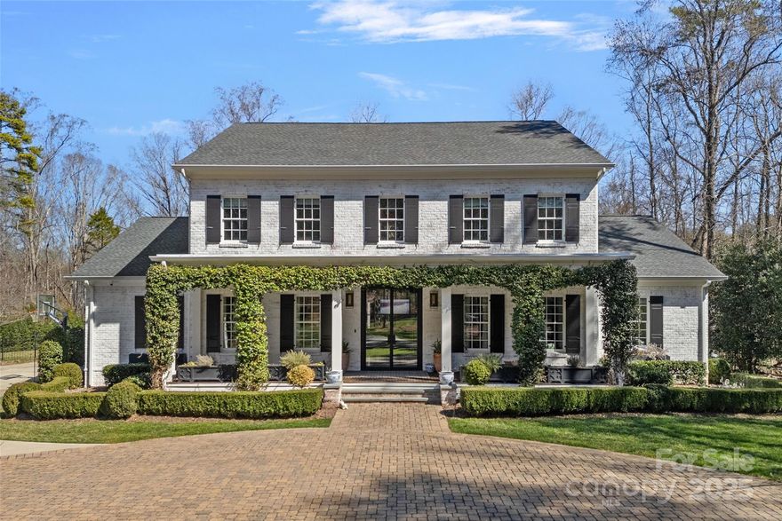This stunning home (designed by architect Sam Greeson) on almost 1.5 acres showcases both luxury and thoughtful design. The main floor has a primary suite, office, dining room, kitchen that is open to a living room and a breakfast room, den, mudroom/drop zone, laundry and two powder rooms.  Upstairs contains four bedrooms and three bathrooms. The outdoor living in this house is truly one of a kind, as the large covered porch overlooks a huge flat backyard displaying a pool and a putting green, set against a horizon of natural area.  There is also a detached 4 car garage with living space (including a full bathroom) above.