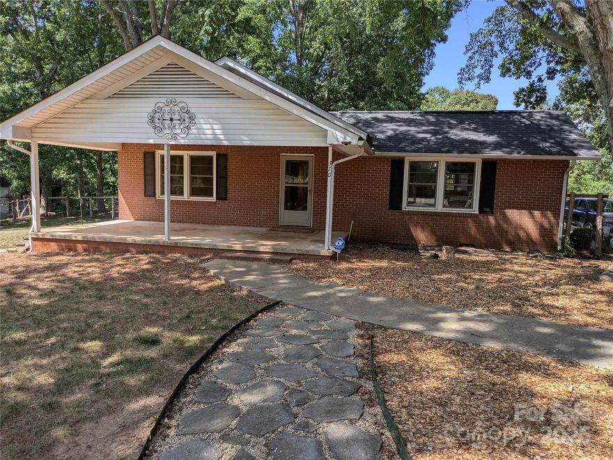 Looking for your own slice of paradise? You've found it here, this affordable home offers you 3 bedrooms, 1 bath, no carpet. The kitchen has plenty of cabinets and counter space. The open floor plan includes a fireplace  in the living room with built in shelving on each side for display your decor and storage too. The mudroom has washer / dryer hook ups and built in shelving for work space for those hobbies or projects. There's even a window unit in the mudroom to keep you cool while you are doing laundry or using that workspace. Enjoy the sunrises and sunsets from your covered front porch overlooking  the fenced yard while the kids or pets play. Have you wanted your own chickens for eggs? The chicken coop remains, so go get yourself some birds and start enjoying your own fresh eggs! Privacy, peace and solitude is waiting for you in this well maintained home. Call and take a look today, you'll be glad you did!!!