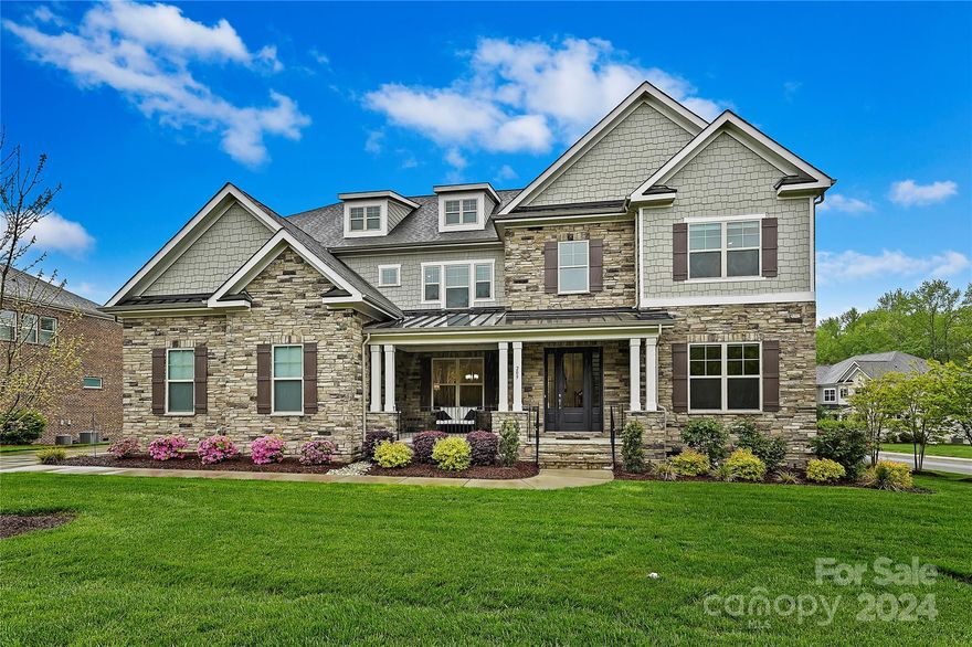 Beyond the Highclere gate is unsurpassed style & splendor.  Inviting porch gives way to wide foyer flanked by office & formal dining.  Statement panels and moldings, coffered ceiling, turned staircase & hand scraped hardwoods are just a few of the design appointments.  Heart of home is spacious and bright with a large great room (remote shades) & a white kitchen w/ casual dining, quartz island, 5 burner gas cooktop stove, farmers sink & butlers pantry.  Primary suites up & down.  Primary up w/ huge shower & free standing tub.  3 large second bedrooms, 2 with shared bath & separate dressing rooms, 1 ensuite.   Bonus/exercise room with barn door entry.  Laundry w/sink.  Folding veranda doors bring the outside in; motorized screens.  Color changing fireplace. Heated pool w/ wi-fi controls, spa, & waterfall; privacy landscaping, fire pit & grill station.  Dehumidifier in crawl.  Wi-fi enabled mechanics. Best life living on Downton Abbey! Award winning schools.  Convenient to everything!