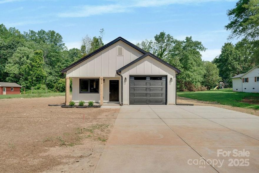 Brand new construction in great area of Lincolnton!  Home sits on almost an acres close, but close to downtown! Single story sprawling ranch boasts 3 bedrooms and 2 full baths with an attached garage! Open concept living area, cathedral ceiling in family room, tray ceilings in master bedroom, recessed lighting throughout, and beautiful view from the rear porch. Upgraded trim package and black matte light fixtures. Soft-close white shaker cabinets and quartz counters with eat-in kitchen. Great location with easy access to shopping and freeways. This is a must see!