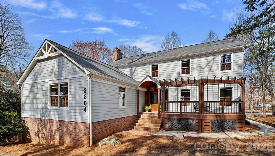 Located on a cul-de-sac in one of Charlotte’s most sought-after neighborhoods, this beautifully updated 4,587 sq ft home offers an exceptional blend of elegance, comfort, and space. Set on 1.02 acres, the property provides a rare sense of privacy and room to enjoy the surrounding landscape while still being part of an established community.

The main level features a bright, open-concept floor plan designed for effortless living and entertaining. At the heart of the home is the renovated kitchen, thoughtfully designed with a professional-grade ZLINE range along with a prep sink, beverage sink, and main kitchen sink—perfect for both everyday functionality and hosting gatherings. Expansive wraparound porches invite you to relax and take in the beauty of the property, offering multiple outdoor spaces to enjoy the peaceful setting.

The primary suite is conveniently located on the main level and has been beautifully updated, creating a private and serene retreat. The finished basement offers second living quarters, providing flexibility for guests, multi-generational living, or an additional recreation space. A three-car garage and generous living areas throughout complete this remarkable property, offering the rare opportunity to enjoy cul-de-sac living on over an acre in one of Charlotte’s premier neighborhoods.
* 2026-27 School Year, the middle school will become JM Robinson Middle School.