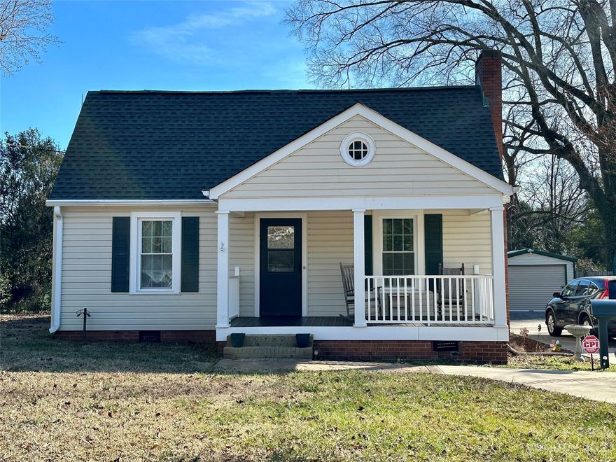 Don't miss this Southern Charm located in the heart of Rock Hill. Rocking chair front porch welcomes you into this beautiful home waiting for its new owners. Large Family room and formal dinning area with plenty of sunlight. Kitchen with new LVP flooring and newer appliances with gas range. Additional living room/flex space/office off of the back of the home with separate entrance. Three spacious bedrooms and updated bathroom. New LVP flooring in bathroom and kitchen, freshly painted interior, newer windows and siding and 3 year old HVAC. Detached garage has endless possibilities. Convenient to downtown Rock Hill, York Tech, Winthrop and I-77. Come see!