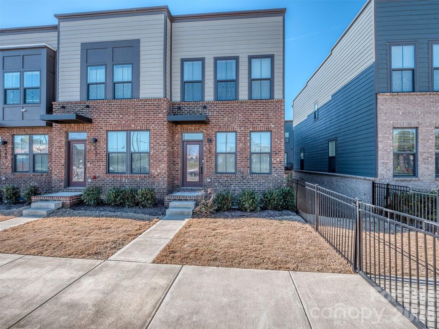 Now is the time to take advantage of Urban Living at it's Finest!  Southrail Station is so conveniently located that you won't believe it!  This meticulously maintained End Unit Townhome is less than a 1/2 Mile to the Light Rail, Multiple Dining & Nightlife Options, close to Breweries, Shopping, & All that South Charlotte Has to Offer!  Are you a dog lover?  You are going to love the building's fenced front yards that provide a great place to let your pups run and play!  The Main Floor has a lovely Great Room, Dining Area, and Gourmet Kitchen with Granite Countertops, Stainless Appliances with built-in microwave, tile backslash, recessed lighting, white cabinets with soft close & a completely open floorplan that is perfect for entertaining!  The 2nd Floor features a spacious Primary Suite with walk-in closet & primary bath with Dual Vanity & Walk-In Shower.  Need a tub?  Not to worry.  The guest suite is complete with a private bath!  The lower level has the 3rd Guest Room that is perfect for a roommate or a Home Office!  If you work from home, each room is hardwired for ethernet too!  Construction just 3 years ago, this townhome is practically brand new!  Come see for yourself the convenience of location and the exceptionalism of design & feature!