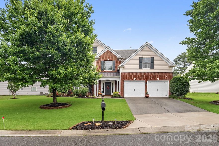 Meticulously maintained home just minutes from charming downtown Waxhaw featuring restaurants, boutiques, and local shops, all within a community zoned for award-winning schools. This beautiful open floor plan offers gleaming hardwood floors, upgraded lighting, elegant black iron stair spindles, and abundant natural light throughout. The formal dining room showcases a tray ceiling, while the gourmet kitchen features granite countertops, tile backsplash, gas range, and newer stainless-steel appliances. The spacious main-level primary suite includes a whirlpool tub, quartz dual vanity, and separate shower with new glass enclosure. Upstairs offers three generously sized bedrooms, including an oversized room perfect for a bonus space or home office, plus convenient walk-in attic storage. Enjoy outdoor living in the private, professionally landscaped backyard oasis complete with mature trees, spacious patio, and multiple seating areas. Beautifully updated and move-in ready inside and out!
