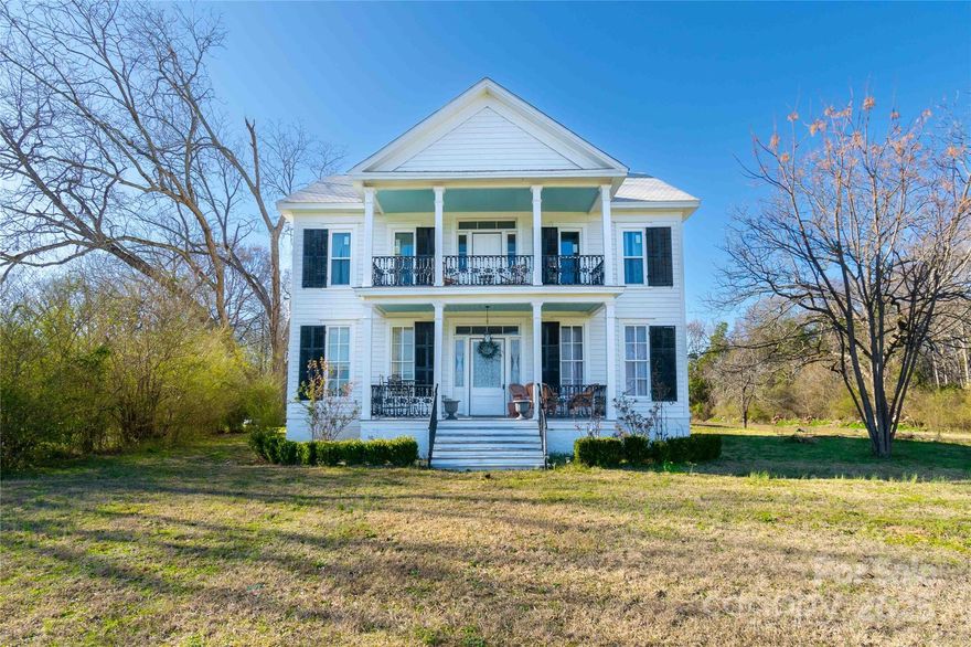 This stunning historic home offers the perfect blend of charm and convenience, nestled between Charlotte and Columbia. Just a scenic 20-minute drive from Rock Hill, South Carolina. This spacious estate boasts soaring 10-foot ceilings and elegant chimneys in every room, adding warmth and character. The primary suite is a true retreat, featuring a generous walk-in closet, a luxurious soaking tub, and polished porcelain tile that enhances the home's timeless appeal. With six beautifully designed bedrooms—each with its own chimney feature—there’s no shortage of cozy spaces. The modernized kitchen is ready to host unforgettable gatherings, while the expansive three-car garage provides ample storage. Sitting on a sprawling 5-acre lot, this exceptional home offers both privacy and endless possibilities.