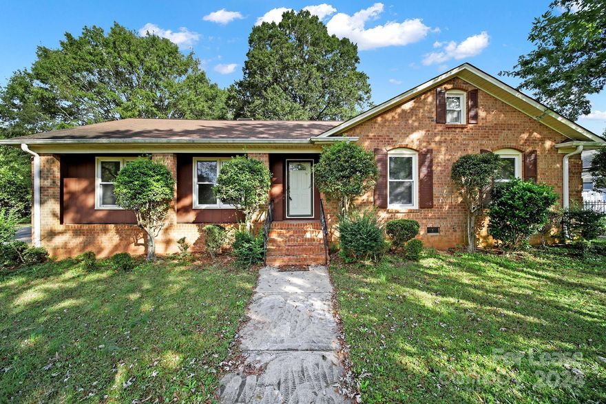 Find your home sweet home in this spacious full brick home on a large corner lot, fully fenced backyard, complete with screened in back porch and built in gas grill. This 3 bedroom 2 full bath home has endless possibilities with a formal dining room as well as dining area off the kitchen and a wood burning fire place in the living room. This home has been updated with all new carpet and fresh paint throughout!