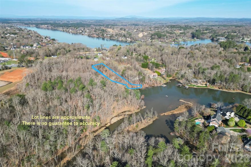 Come take a look at one of the few remaining lots in Lake Hickory, nestled in the heart of the Carolina foothills! With unobstructed water views and direct lake access. The parcel offers county water, a sea wall and a boat dock. Situated in a highly sought-after location in Hickory, positioning you to downtown, dining and shopping within minutes. Tour it today!