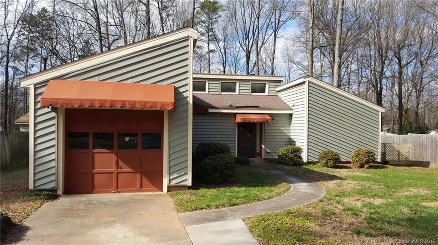 Great investment opportunity!  Priced below tax value.  Cute contemporary with one car garage, galley kitchen and a fireplace.  2 of the bedrooms have their own private bath.  Huge backyard with 2 sheds.