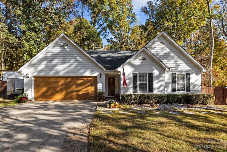This charming 1 story ranch home is nestled on a Cul-de-sac lot in the desirable Catawba Springs community. With 3 bedrooms 2 full baths it features modern finishes, vaulted ceiling, a wood burning fire place and luxury plank vinyl flooring throughout.  Kitchen has granite countertops, newer appliances and a center island breakfast bar. Primary bedroom has walk-in closet and ensuite bathroom with dual vanity, soaking tub and separate shower.   Easily entertain on the rear porch with large deck and spacious fenced-in back yard. No HOA and lower Lincoln Cty taxes make this even more attractive.  Great location!!  Just minutes from Hwy 16 with short commute to Charlotte, Huntersville, Mooresville or Lincolnton.  Convenient access to grocery stores, breweries, parks, Lake Norman and all of the amenities a big city offers with a quiet small town feel.