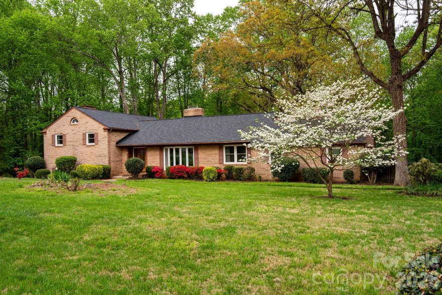 OPEN HOUSE THIS SUNDAY (4/26) from 10:00-12:00pm. Set on 1.35 acres, 234 Edgewood Drive offers a spacious and versatile layout with 3 bedrooms, 3.5 bathrooms, and approximately 3,609 square feet. The home features multiple living and gathering spaces, including a living room with fireplace, dining room, and a bright sunroom connected to an open sitting area and kitchen. The lower level bonus space adds flexibility for recreation, hobbies, a potential guest suite, an additional bedroom, or entertaining. Interior highlights include a completely remodeled kitchen with updated appliances, hardwood floors, marble countertops, built-in shelving, and generous storage throughout. Outdoor living is equally inviting, with a large back deck overlooking the fenced yard, patio area, raised garden boxes, and a small creek that adds to the setting. Conveniently located just 2.5 miles from I-77, 10 minutes from downtown Statesville, 50 minutes from Charlotte Douglas Airport, and 25 minutes from Lake Norman State Park, this property offers a blend of comfortable living, functional space, and everyday accessibility. A home with lots of character, privacy, and space to make your own, 234 Edgewood Drive combines warmth, functionality, and convenience, ready to welcome its next chapter.