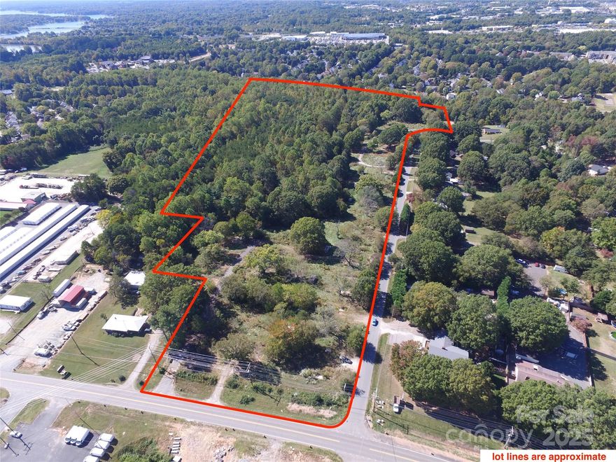 Twenty-seven acres in Mooresville in a Prime location right off Highway 21 at exit 33, with unbeatable access to shopping, restaurants, and grocery stores. The front one-and-a-half to two acres are zoned Community Commercial, perfect for business ventures, while the rear acreage is zoned RLS, offering flexibility for development. This fabulous tract is minutes from Lowe’s headquarters, Langtree, and downtown Mooresville’s vibrant core. Public water and sewer are readily available, making this an ideal opportunity for investors or developers looking to capitalize on a growing area.