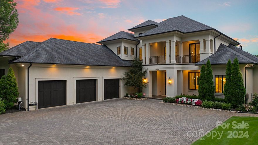 Nestled along the pristine shores of Lake Norman, this breathtaking waterfront estate redefines luxury resort-style living, with included helipad on dock. Designed with entertaining in mind, this residence seamlessly combines harmony and tranquility, offering over 8,500 square feet of versatile space for year-round gatherings, both indoors and outdoors. Immerse yourself in the vibrant seasons of the Carolinas while enjoying an extraordinary lifestyle along the picturesque 500 miles of Lake Norman's shoreline, complete with stunning sunsets, exquisite waterfront dining, and relaxing boat rides. Located at 19004 Double Eagle Drive, this remarkable home showcases contemporary architecture, elegance, and luxury, establishing a new benchmark for upscale waterfront living.