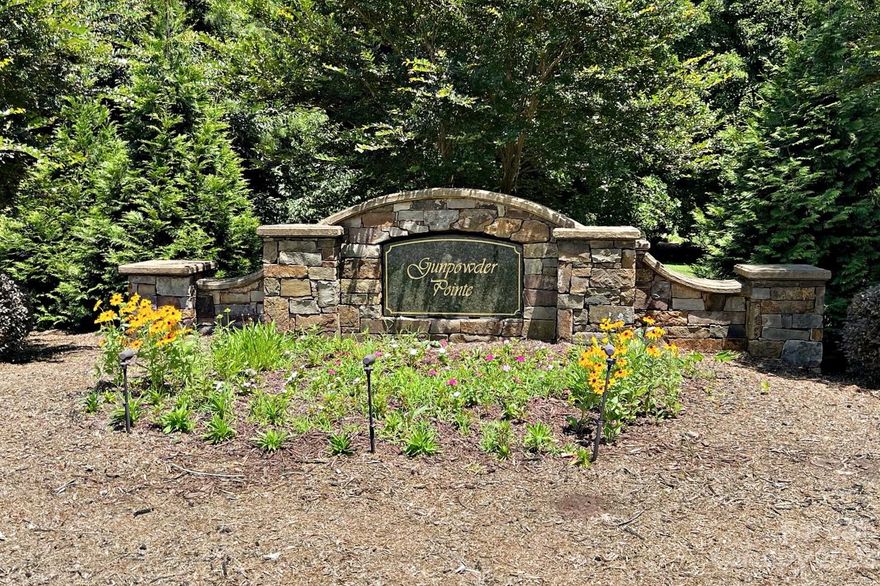 Great building lot in desirable lakefront community of Gunpowder Pointe. The new buyer of this lot will enjoy seasonal lake views and their own deeded boat slip. There is a gated dock area with lighted parking, and a beautiful setting. The dock area has recently been upgraded with new decking.  The seller had the lot partially cleared to allow easy access to walk the lot and also have a septic permit for a 3 bedroom home. Even if you don't build right away it is great to have access to your own boat slip and build your dream home eventually.