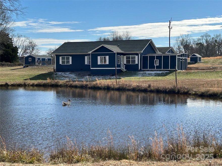 Back on market 3/10 - Buyer's situation changed. 3BR/2.5BA home on 4.5 acres w/spring-fed pond & country feel! Home sits back off road & has picturesque setting w/house overlooking pond! This home has many fine features that include inground saltwater pool w/building, goat/animal pen, tractor shed, oversized carport, 21x20 multi-purpose attachment currently used as a gym, 400 sq.ft. covered back deck, and that's just on the outside! Interior features include kitchen w/good cabinet & counter space that opens into good-sized dining area, large living room, bonus room w/half bath (currently used as an office), Primary Bedroom overlooks pond & has bathroom suite, and laundry area off kitchen. There is also an awesome game room addition. Roof 2019. Pool liner 2019. Pond 2020. HVAC 2023. Pool motor 2023. Pool converted to saltwater in 2024. Pond is stocked & has 2 resident Chinese Swan Geese. Property has long driveway, please DO NOT go on property without an appointment, thanks! Call w/?'s.