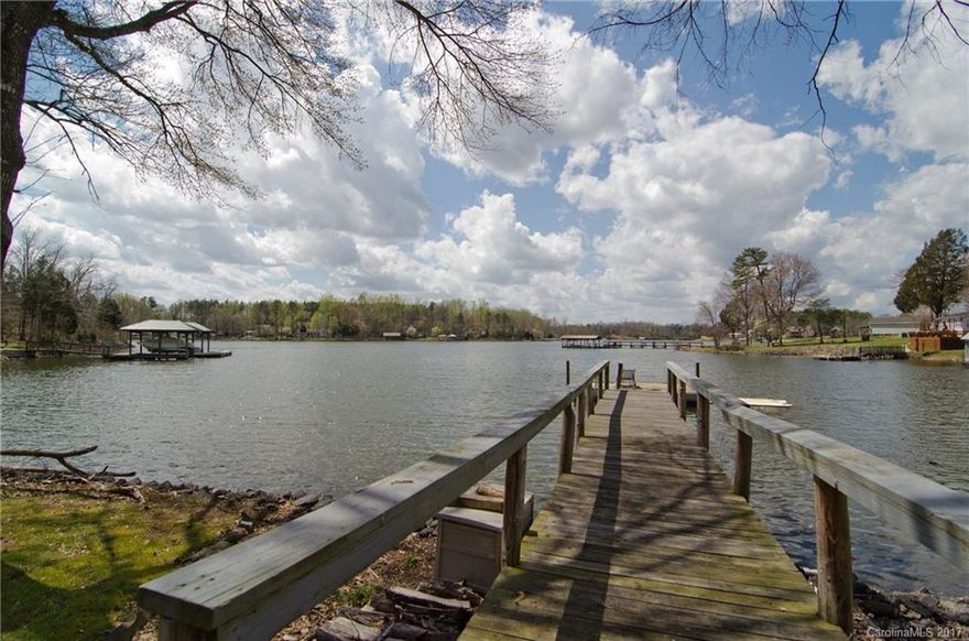 Awesome waterfront listing with 2 docks!!Unheard of in Lake Wylie and close to bridge for commuters. Huge rocking chair front porch to enjoy expansive views of Crowder's Creek. Open, comfy floorplan with one bedroom on main floor. Home features fenced yard, 2 sheds for many uses, 1+ acre lot, very private, & over 200 foot of water frontage. Come bring friends and all of your water toys!