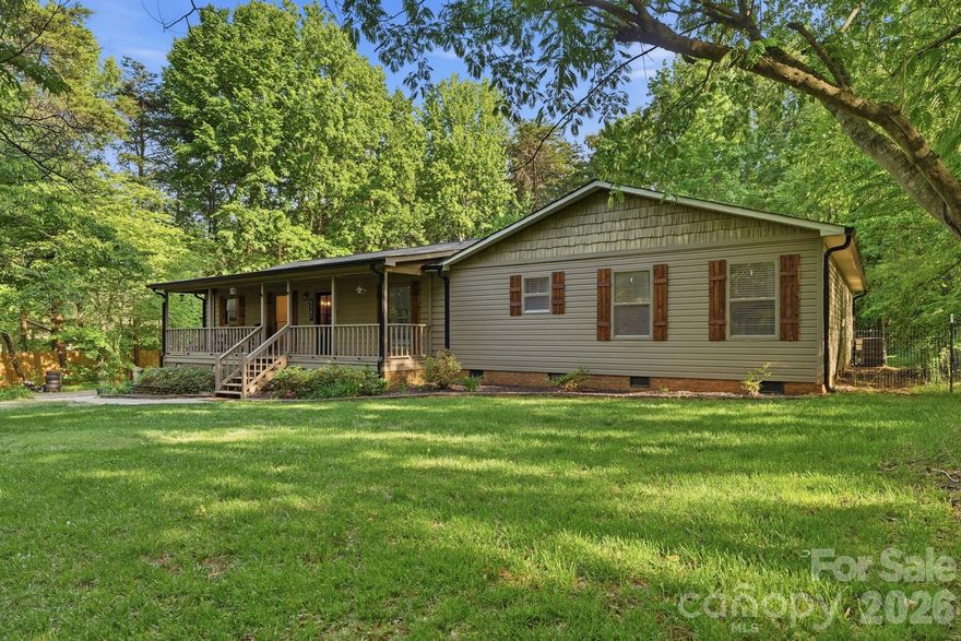 Set on 2.2 serene acres, this property delivers the homestead lifestyle so many dream of—space for chickens, gardens, and a life lived closer to the land, all just minutes from shopping, dining, and the waters of Lake Wylie. A full interior renovation brings modern comfort to the forefront, featuring a brand-new kitchen with all SS appliances, a whole-house water filtration system, and a wood-burning fireplace with a new damper that anchors the living space with rustic charm. The rocking-chair front porch invites slow mornings, while the back patio offers peaceful evenings overlooking your private acreage.  Park your RV or camper on the property will full electric hookups. Thoughtful upgrades include a fully encapsulated crawl space with a dehumidifier, NEW HVAC 2025, NEW roof installed 2021, a new long asphalt driveway is perfect for parking several vehicles, your boat and RV.  Well was serviced just last year with a new bladder tank and upgraded water pressure. Water is conveniently run to the chicken coop and garden area, making homesteading effortless. With 5 bedrooms plus an office off the mudroom, this home blends function and flexibility. Zoned for the new Lake Wylie High School and wrapped in quiet, natural beauty, this is a rare retreat where modern living and country serenity meet.  Best of all, no HOA!